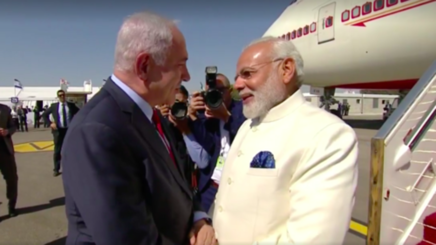 Prime Minister Benjamin Netanyahu (left) greets Indian Prime Minister Narendra Modi upon Modi's arrival in Israel Tuesday. Credit: Prime Minister Benjamin Netanyahu via Facebook.