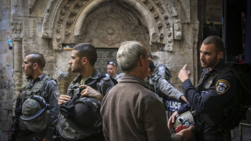 Click photo to download. Caption: Israeli Border Police officers guard the entrance for Palestinians to the Dome of the Rock and the Al-Aqsa mosque in Jerusalem's Old City on Monday, Oct. 13, 2014. Earlier that day, Palestinian rioting at Al-Aqsa forced Israeli security forces to limit the number of Palestinians allowed to enter the Temple Mount compound. Credit: Hadas Parush/Flash90.