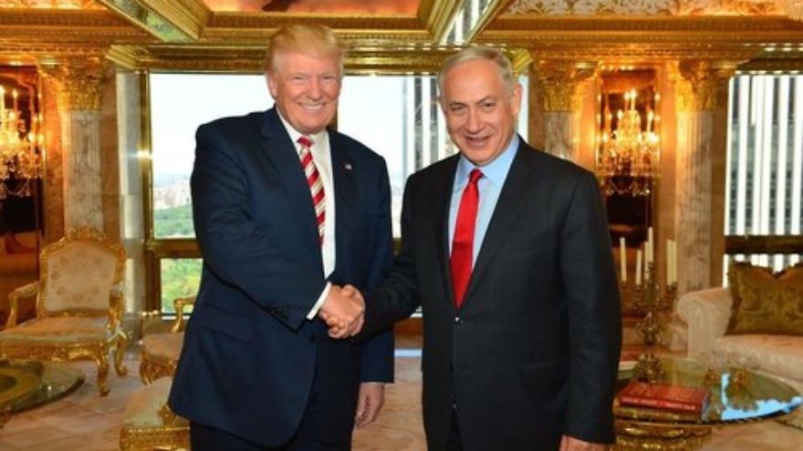 Donald Trump (left) shakes hands with Israeli Prime Minister Benjamin Netanyahu during their meeting at Trump Tower in New York City in September 2016. Credit: Kobi Gideon/GPO.