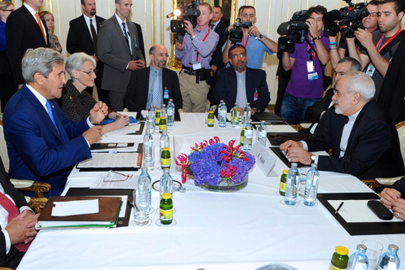 U.S. Secretary of State John Kerry (center left) prepares to sit down with Iranian Foreign Minister Mohammad Javad Zarif (center right) in Vienna, Austria, on July 14, 2014, before they begin a bilateral meeting focused on Iran's nuclear program. Credit: U.S. State Department.