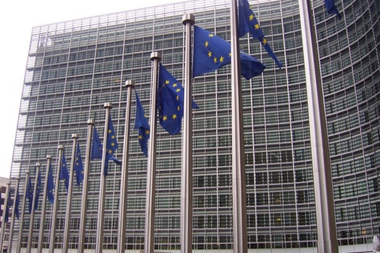 E.U. flags in front of the European Commission building in Brussels. Credit: Amio Cajander via Wikimedia Commons.