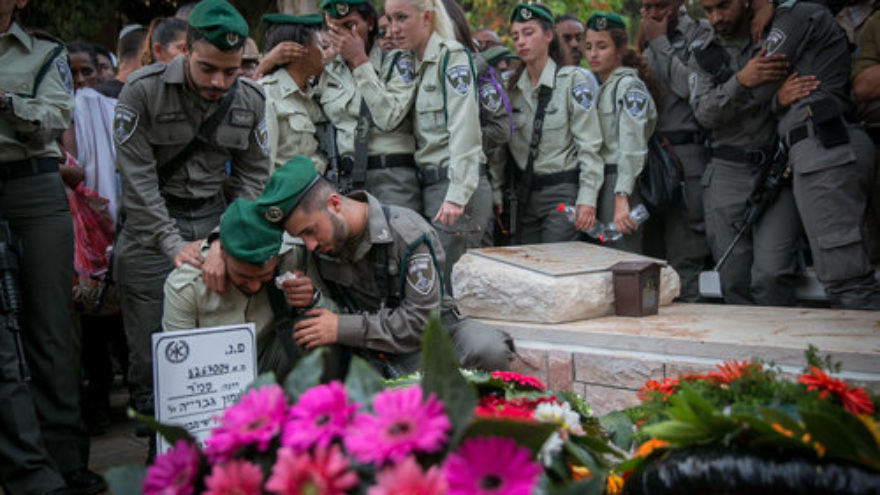Israelis mourn slain Border Police officer Solomon Gavriyah, 20, during his funeral in Be’er Yaakov. Gavriyah was killed in a Palestinian terror attack Sept. 26 in Har Adar, near Jerusalem. Credit: Miriam Alster/Flash90.