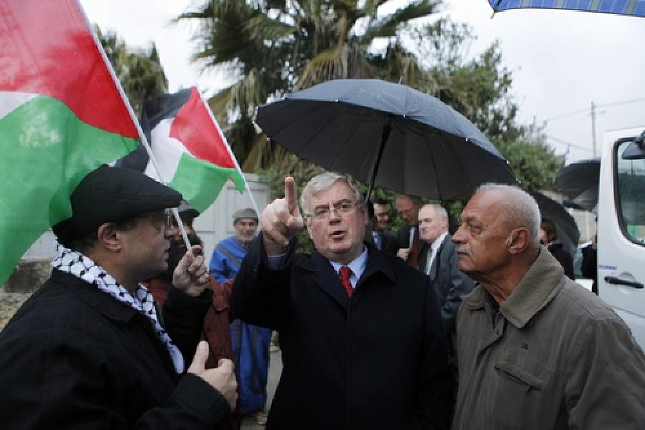 Irish Foreign Minister Eamon Gilmore gestures while talking with Palestinian demonstrators at the weekly gathering in the mostly Arab neighborhood of Sheikh Jarrah in eastern Jerusalem on Jan 27, 2012. Within an Irish government that frequently condemns Israel for its treatment of the Palestinians, Gilmore is one of the most outspoken critics of the Jewish state. Credit: Sliman Khader/FLASH90.