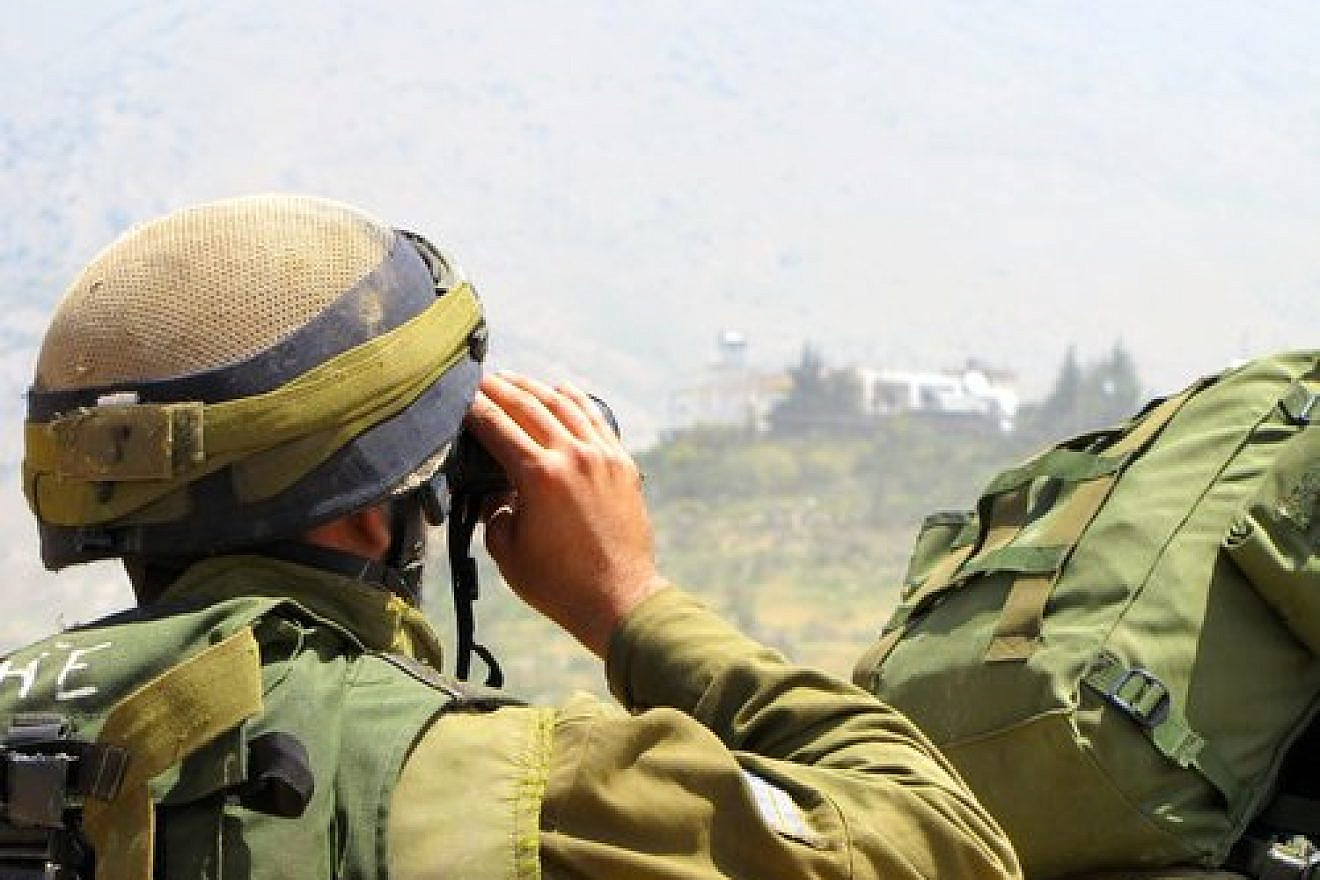 An Israeli soldier patrols near the Israel-Syria border in the Golan Heights. Credit: IDF.