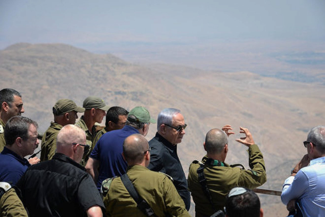 Israeli Prime Minister Benjamin Netanyahu and Security Cabinet members look into Syria from the Golan Heights, Feb. 6, 2018. Photo by Kobi Gideon/GPO.