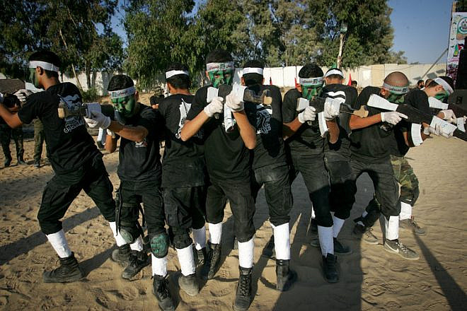 Palestinian youths participate in the graduation ceremony for a military-style camp organized by the Hamas terror group in Gaza on Aug. 18, 2017. Credit: Abed Rahim Khatib/Flash90.