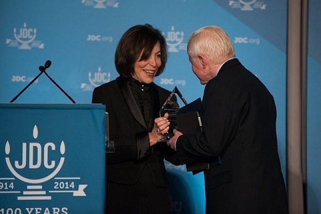 Click photo to download. Caption: Penny Blumenstein, the new president of JDC, presents José L. Cuisía, Philippine ambassador to the United States, with JDC’s Or L’Olam Award on Dec. 11 in Washington, DC. Credit: Richard Greenhouse for JDC.