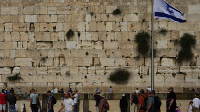 An Israeli flag at the Western Wall in Jerusalem. Credit: Emmanuel DYAN via Wikimedia Commons.