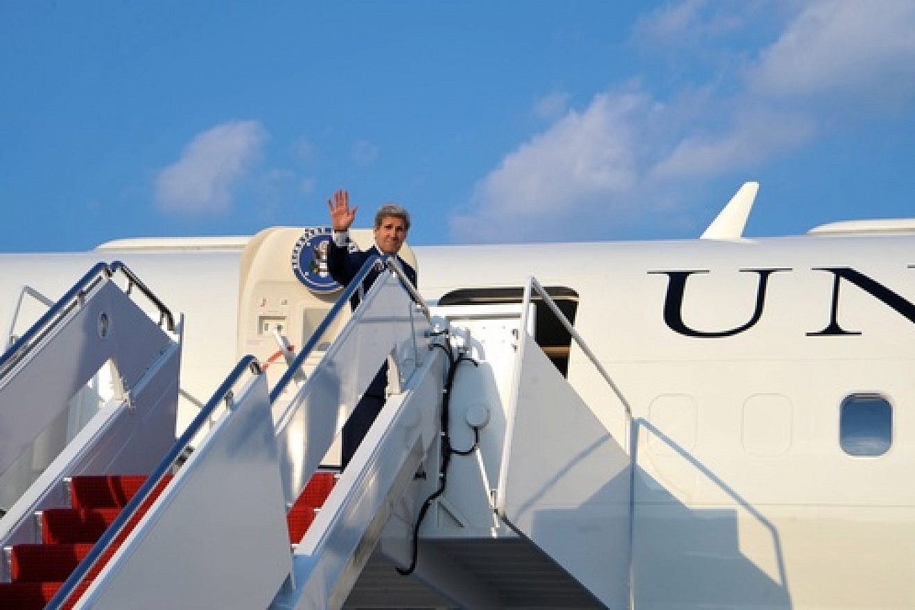 U.S. Secretary of State John Kerry  boards his plane at Andrews Air Force Base for a flight to Amman on July 15, 2013. On that trip to Jordan, Kerry said Arab ministers told him that the core issue of instability in the region and other parts of the world is the Palestinian-Israeli conflict. Credit: U.S. State Department.