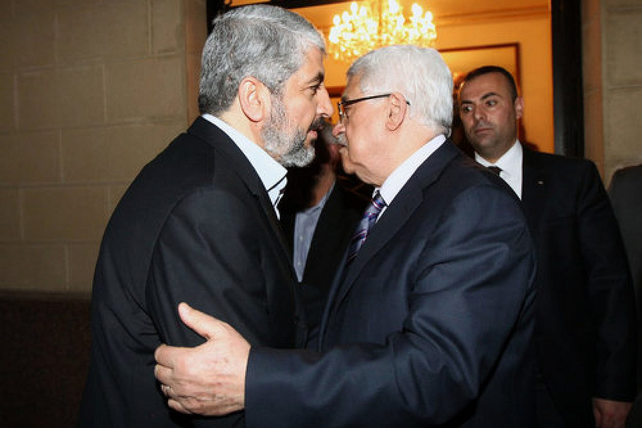 Hamas leader Khaled Mashaal (left) meets with Palestinian Authority head Mahmoud Abbas in Cairo, Feb. 23, 2012. Photo by Mohammed al-Hums/Flash90.