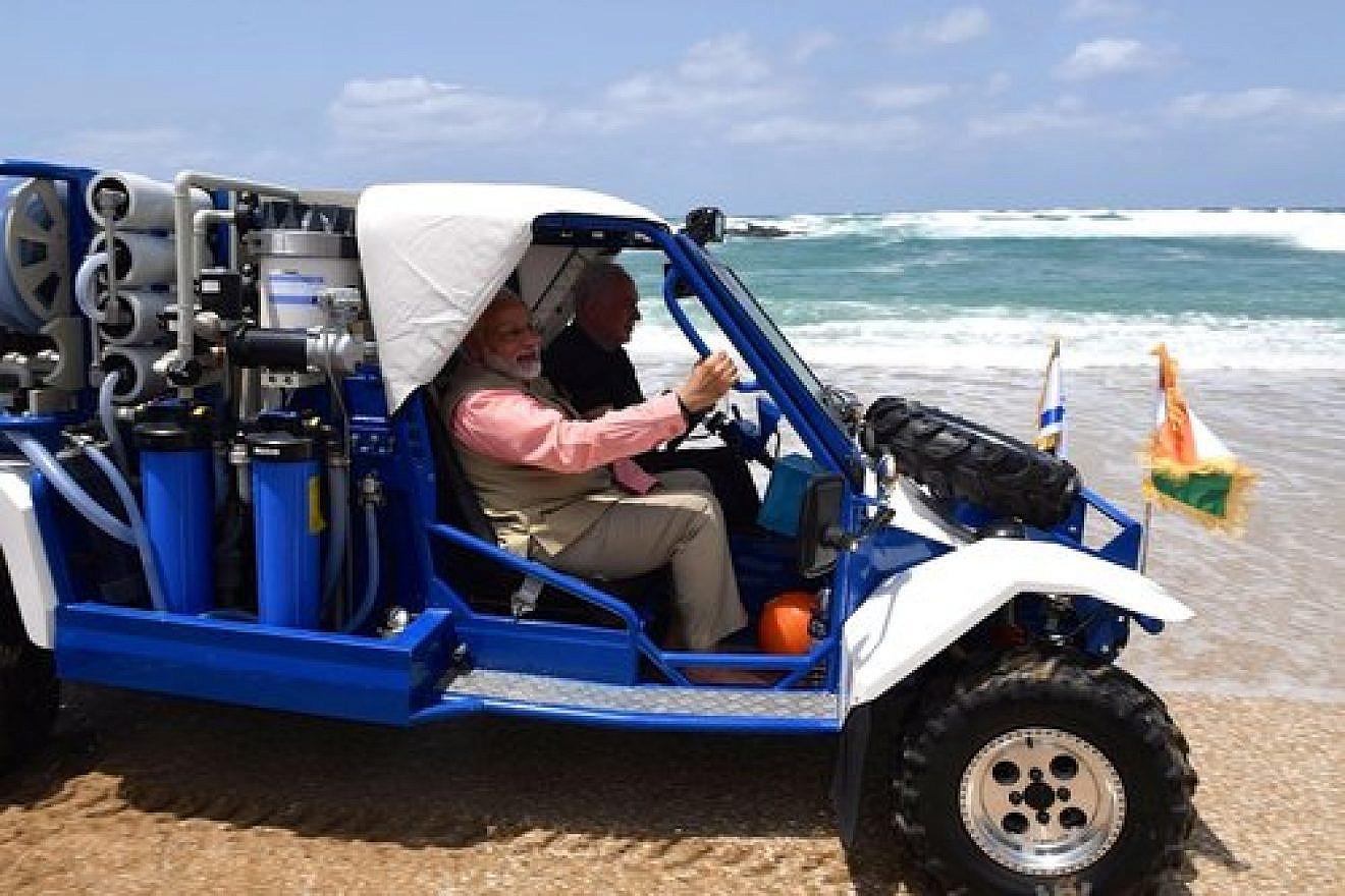 Indian Prime Minister Narendra Modi and Israeli Prime Minister Benjamin Netanyahu take a jeep ride on the Olga Beach in northern Israel Thursday. Credit: Kobi Gideon/GPO.
