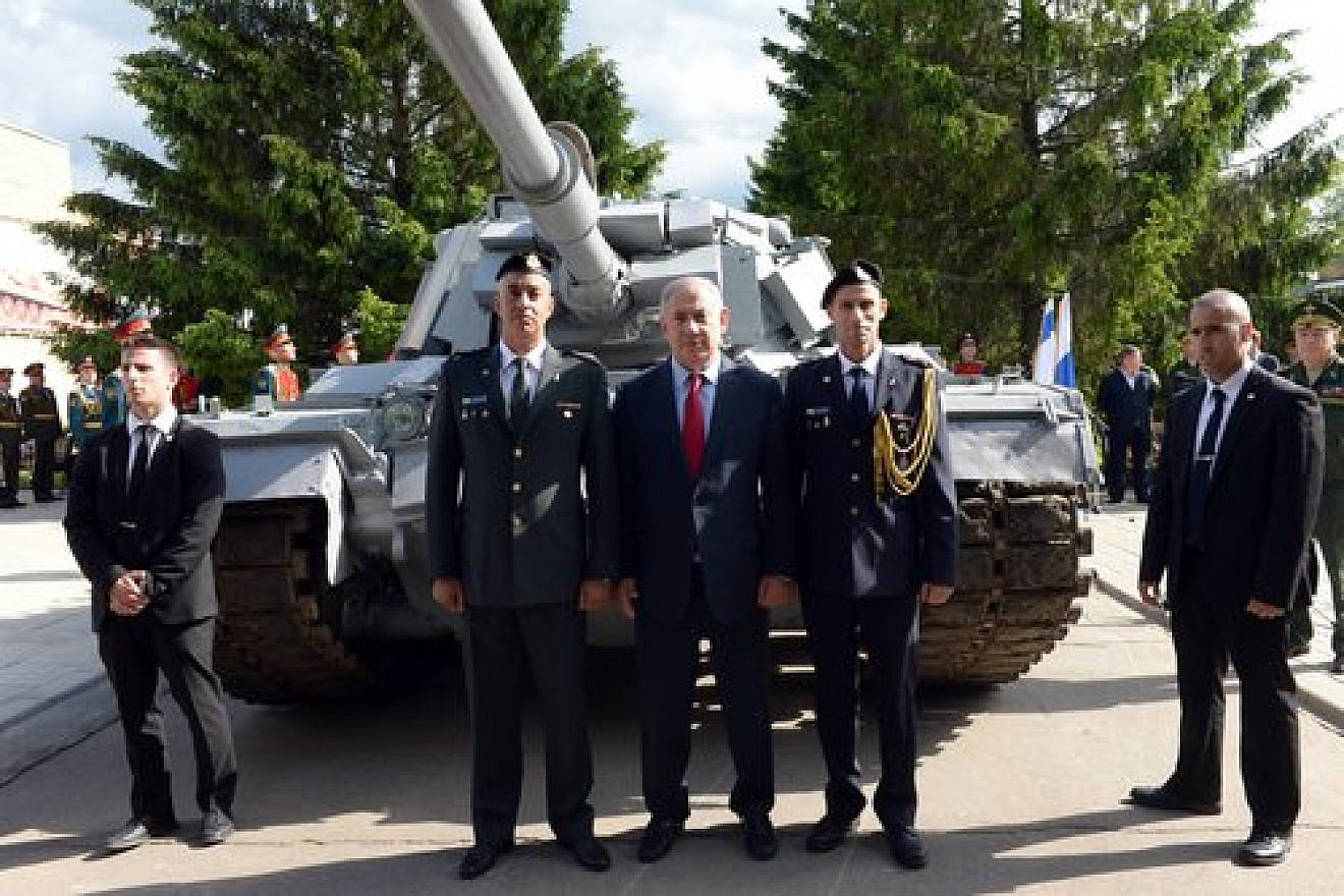 Israeli Prime Minister Benjamin Netanyahu (center) visits an armory museum in the Russian capital of Moscow June 8, 2016. The museum housed an Israeli tank captured by the Syrian army during the First Lebanon War's battle of Sultan Yacoub, but following a request by Netanyahu, Russian President Vladimir Putin agreed to return the tank to Israel. Credit: Haim Zach/GPO.