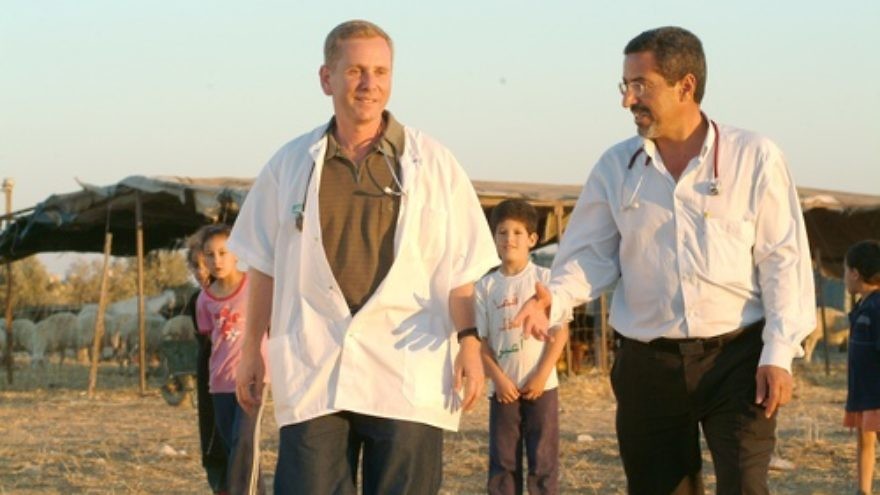Dr. Ohad Birk (pictured in front, on the left) working with Bedouin. Birk has announced the discovery of a genetic mutation in Moroccan Jews that leads to a crippling disease he is calling PCCA2. Credit: Dani Machlis.