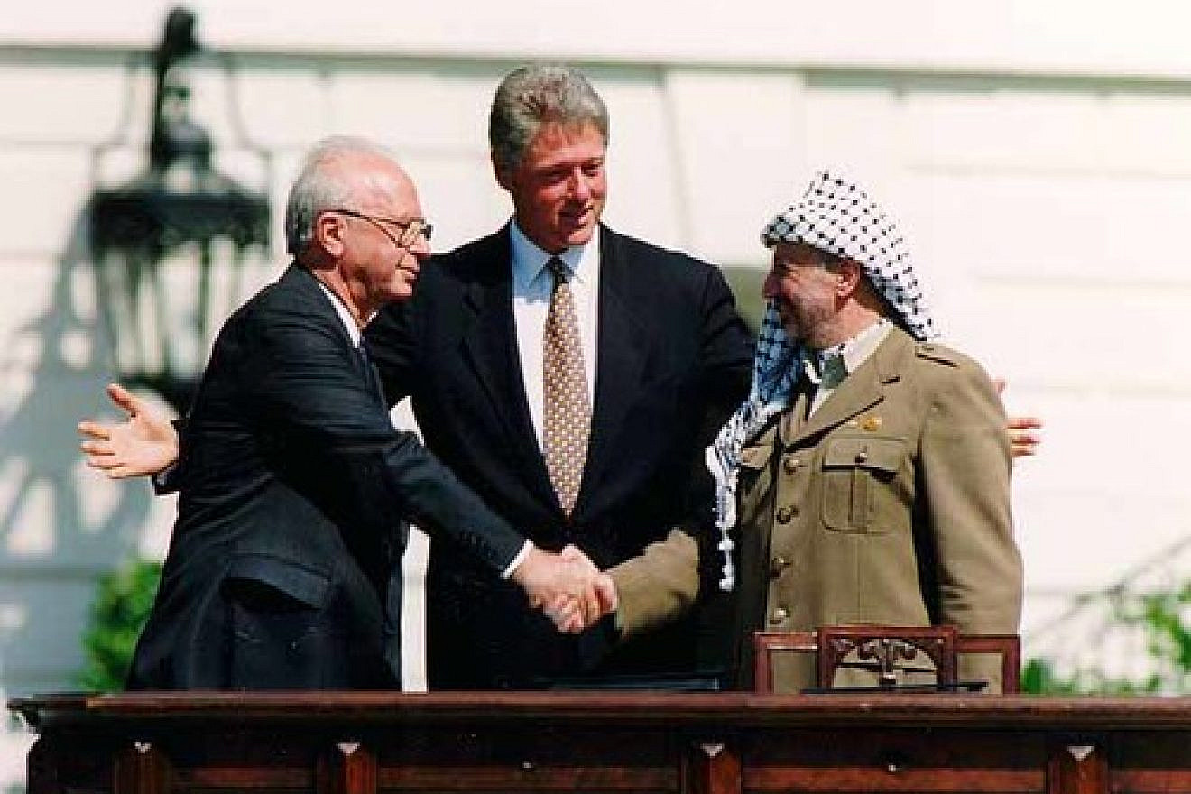 Yitzhak Rabin, Bill Clinton, and Yasser Arafat at the signing of the Oslo Accords on Sept. 13, 1993. In an op-ed for JNS.org, Israeli Deputy Defense Minister Danny Danon wrote of renewed Israeli-Palestinian conflict negotiations, "Almost 20 years after Yitzhak Rabin attempted to conjure arch-terrorist Yasser Arafat into a worthy partner for peace, it seems that we have not learned the lessons from the past." Credit: Vince Musi/The White House.