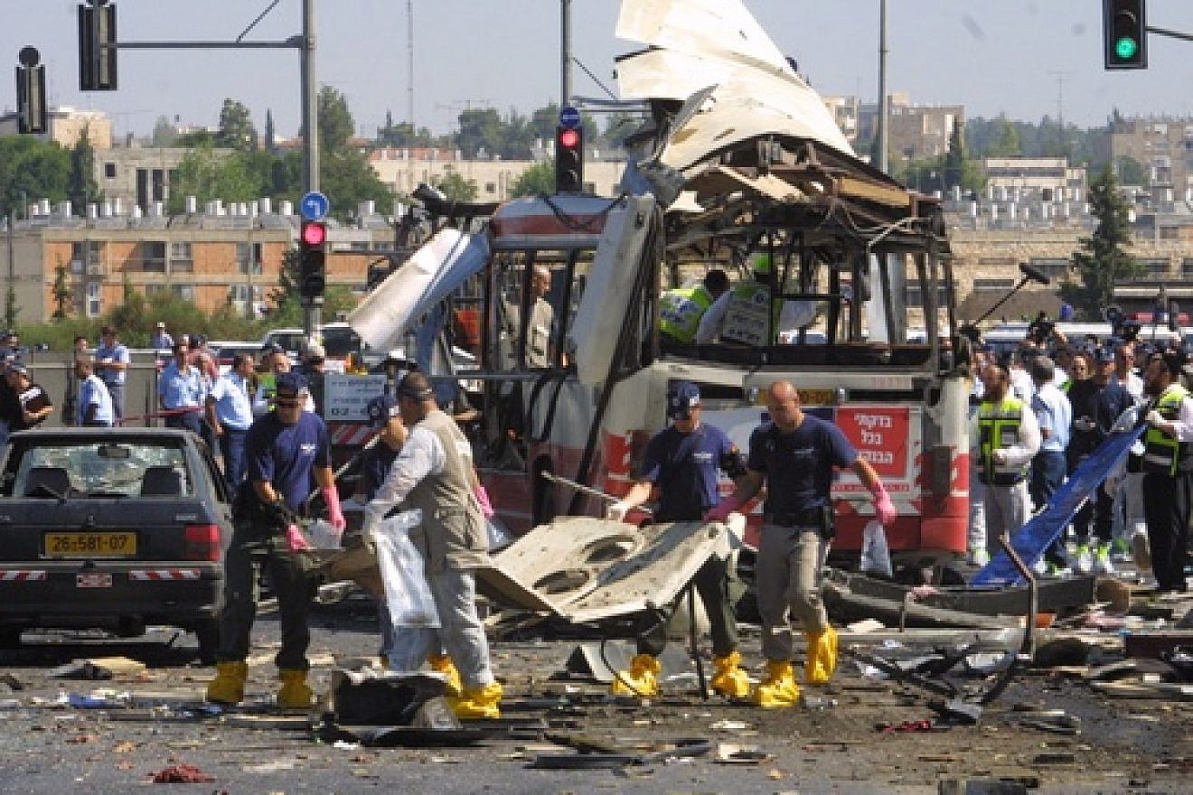 Paramedics and police at the scene of a Palestinian suicide bombing, killing 19 and injuring 74, on a bus in Jerusalem on June 18, 2002. Photo by Flash90.
