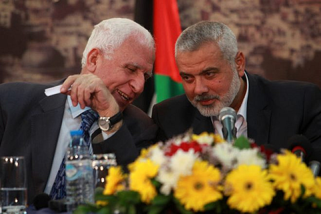 File photo: Head of the Hamas government Ismail Haniyeh (right) and senior Fatah official Azzam Al-Ahmed at a news conference in Gaza City. Credit: Abed Rahim Khatib/Flash90.