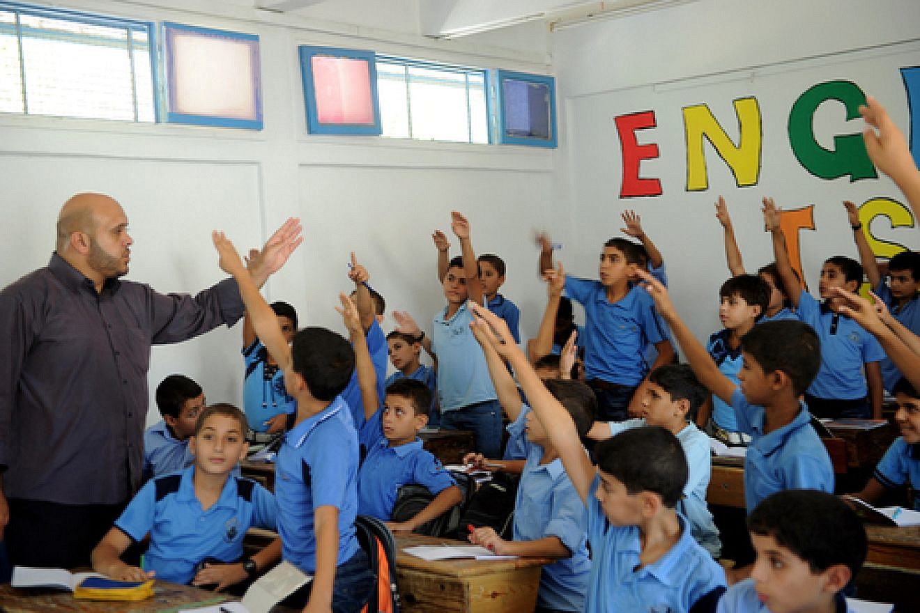 Boys raise their hands at a U.N. school in the Gaza Strip, September 2011. Credit: U.N. Photo/Shareef Sarhan.