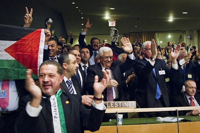 Members of the Palestinian delegation at the United Nations General Assembly celebrate on Nov. 29, 2012, upon the vote to upgrade Palestinian status to a nonmember observer state in the U.N. Credit: UN/Rick Bajornas.
