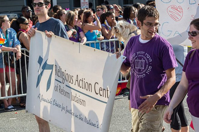 Representatives of the Religious Action Center of Reform Judaism march in a June 2014 gay pride parade in Washington, D.C. Credit: Tim Evanson via Wikimedia Commons.