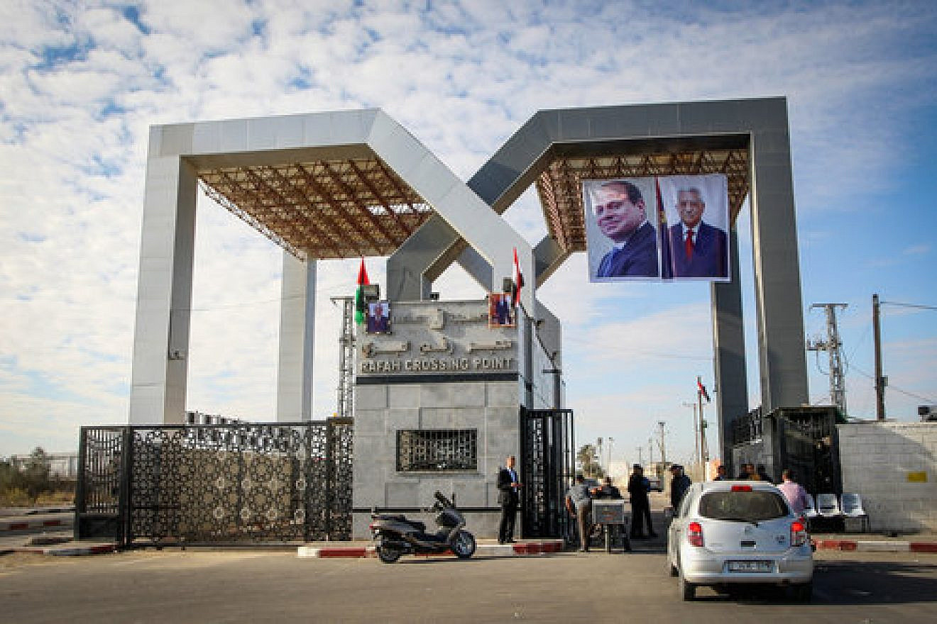 Pictures of Egyptian President Abdel Fattah el-Sisi and Palestinian Authority leader Mahmoud Abbas hang at the Rafah border crossing between Sinai and the Gaza Strip, Nov. 1, 2017. Photo by Abed Rahim Khatib/Flash90.