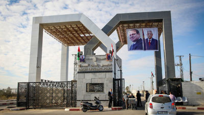 At right, photos of Egyptian President Abdel Fattah El-Sisi and Palestinian Authority (PA) President Mahmud Abbas hang at the Rafah border crossing between Egypt and the Gaza Strip on Nov. 1, 2017. While Hamas has given the PA administrative control of the Rafah checkpoint, the complete transfer of power in Gaza has been delayed from Dec. 1 to Dec. 10. Credit: Abed Rahim Khatib/Flash90.