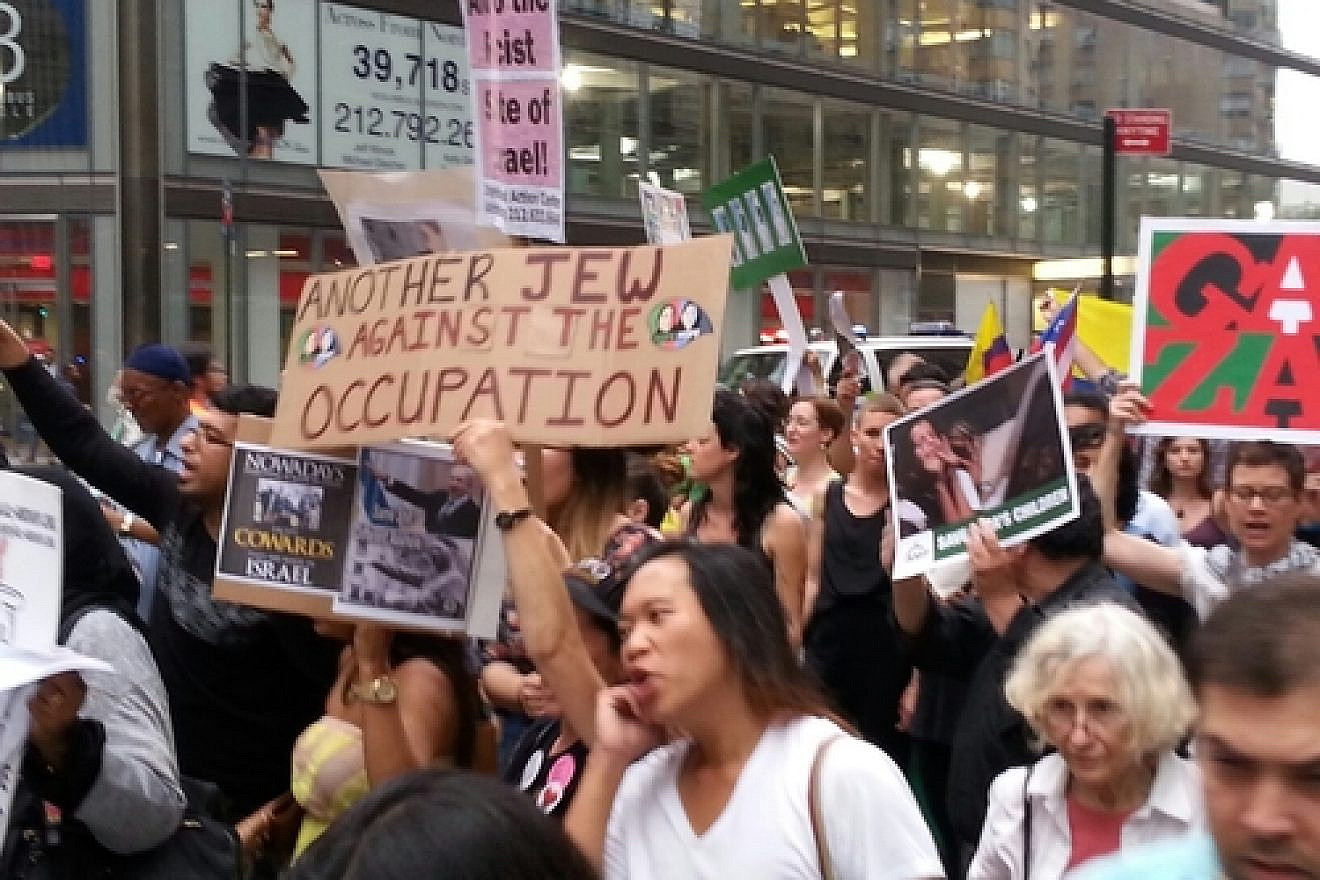 An anti-Israel demonstration in Manhattan's Columbus Circle, including a Jewish anti-Zionist sign reading, “Another Jew Against the Occupation.” Credit: Ben Cohen.
