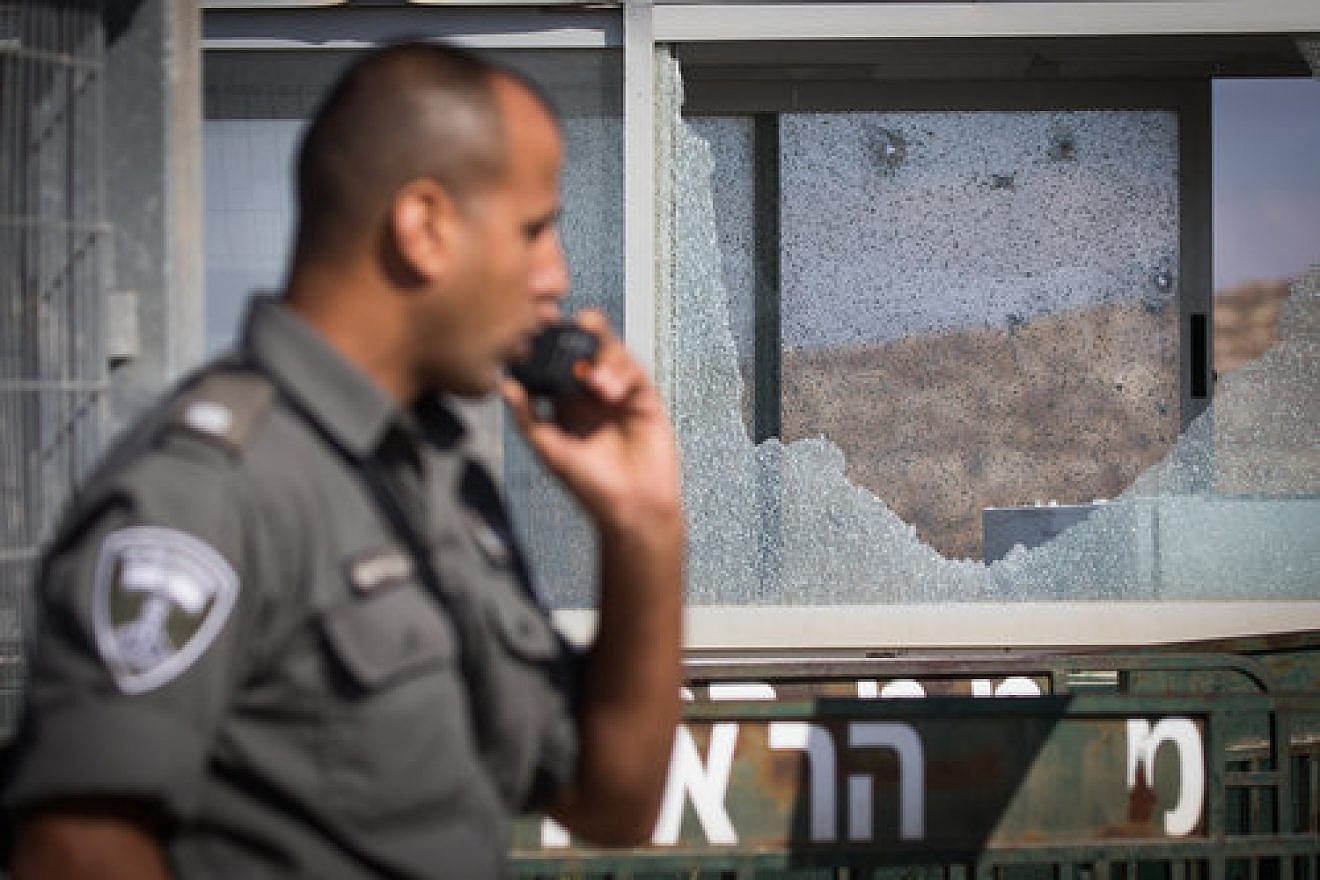 A security officer at the scene where a Palestinian terrorist killed three Israelis in a shooting attack in Har Adar, near Jerusalem, Sept. 26. Credit: Yonatan Sindel/Flash90.