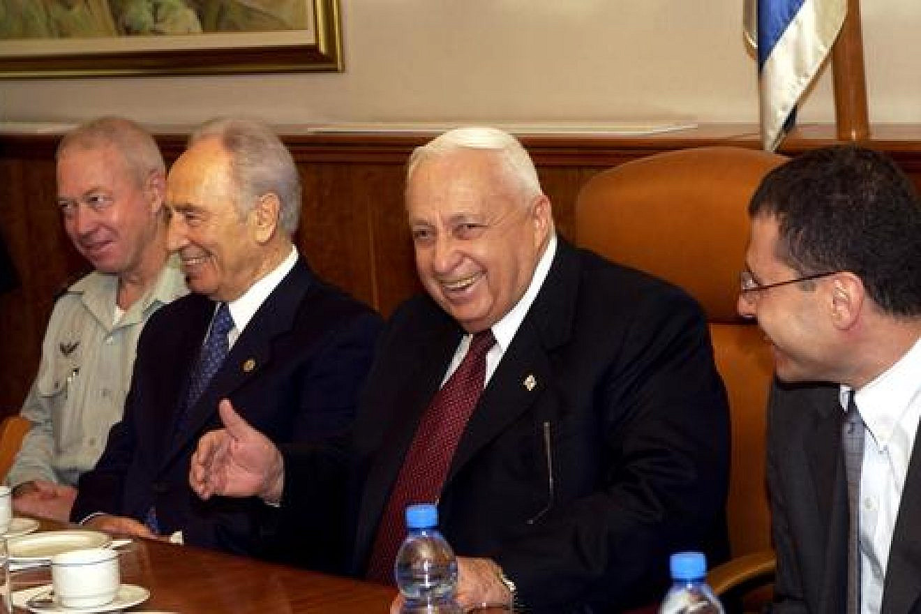 Click photo to download. Caption: Shimon Peres (second from left) and then-Prime Minister Ariel Sharon seen during the 80th birthday celebration for Peres in the Prime Minister's Office in Jerusalem on September 21, 2003. Crediit: Avi Ohayon/GPO/Flash90.