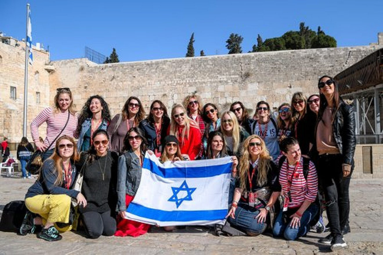 Participants of the Jewish Women’s Renaissance Project’s “Media Magnets” trip to Israel are pictured at the Western Wall in Jerusalem. Credit: Aviram Valdman.
