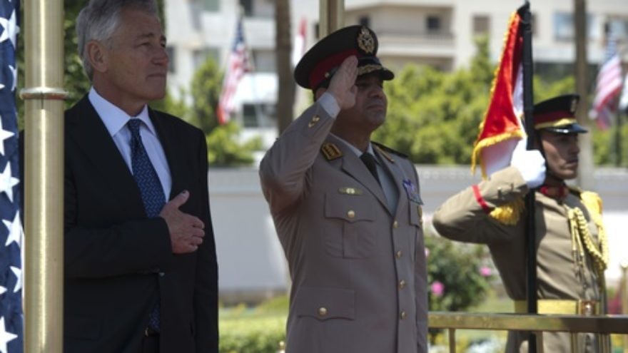 U.S. Secretary of Defense Chuck Hagel (left) participates in an arrival honors ceremony with Abdel Fattah El-Sisi (center), then the Egyptian Minister of Defense, in Cairo on April 24, 2013. Credit: Erin A. Kirk-Cuomo/Secretary of Defense via Wikimedia Commons.