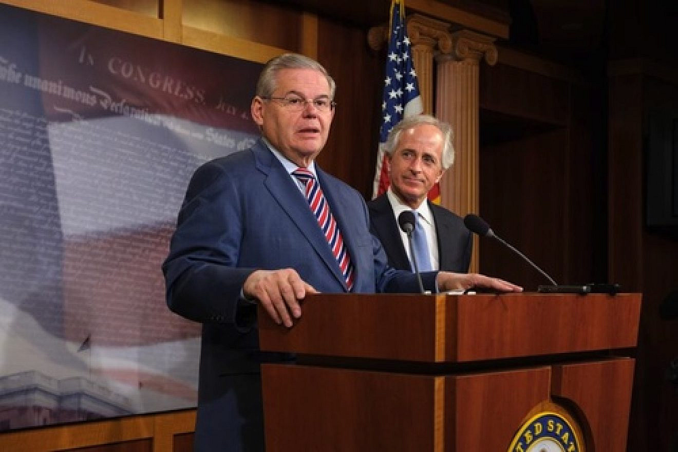 Sen. Robert Menendez (D-N.J.) speaks at a press conference in March that followed the Senate's passage of a bill on Ukraine. Looking on is Sen. Bob Corker (R-Tenn.), whose amendment proposing congressional oversight of a deal on the Iran nuclear program this month prompted Menendez, chair of the Senate Foreign Relations Committee, to withdraw the U.S.-Israel Strategic Partnership Act of 2013. Credit: Office of Sen. Robert Menendez.