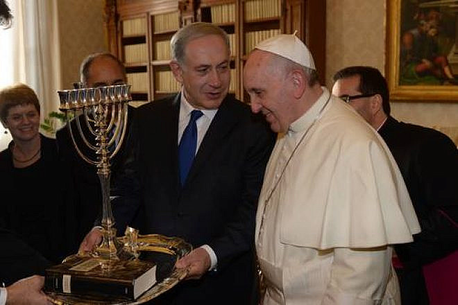 Israeli Prime Minister Benjamin Netanyahu presents Pope Francis with a menorah during their meeting at the Vatican on Dec. 2, 2013. Pope Francis visited Israel, Jordan and the West Bank from May 24-26. Credit: Amos Ben Gershom/GPO/Flash90.