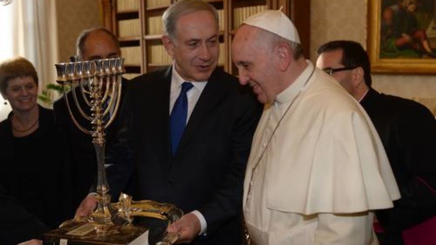Israeli Prime Minister Benjamin Netanyahu presents Pope Francis with a menorah during their meeting at the Vatican on Dec. 2, 2013. Pope Francis visited Israel, Jordan and the West Bank from May 24-26. Credit: Amos Ben Gershom/GPO/Flash90.
