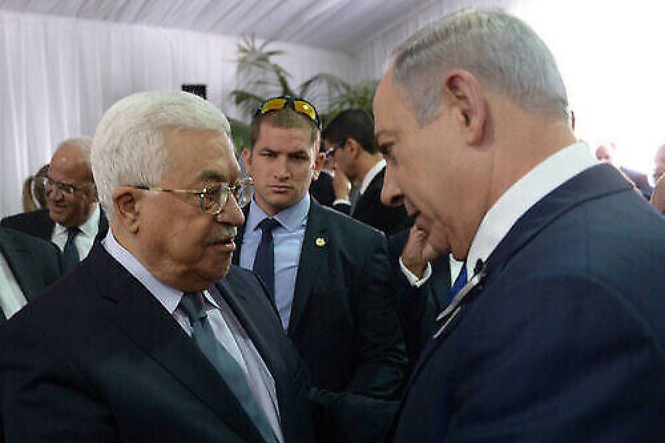 Israeli Prime Minister Benjamin Netanyahu meets with Palestinian Authority leader Mahmoud Abbas during the funeral of late Israeli President Shimon Peres, held at Mount Herzl in Jerusalem on Sept. 30, 2016. Credit: Amos Ben Gershom/GPO.