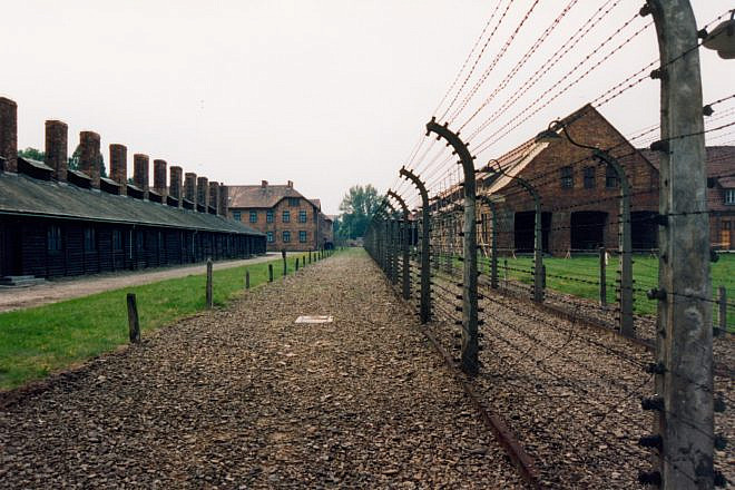 The site of the former Auschwitz concentration camp in Poland. A controversial new law passed by Poland's parliament is rooted in Polish resentment when Auschwitz and other Nazi German concentration camps are referred to as “Polish death camps.” Credit: Giraud Patrick via Wikimedia Commons.