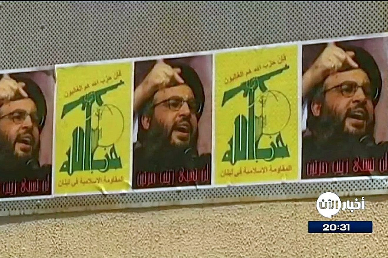 Posters of Hezbollah’s flag and the terrorist group’s leader, Hassan Nasrallah, in Beirut. Credit: Al Aan Arabic Television via Wikimedia Commons.