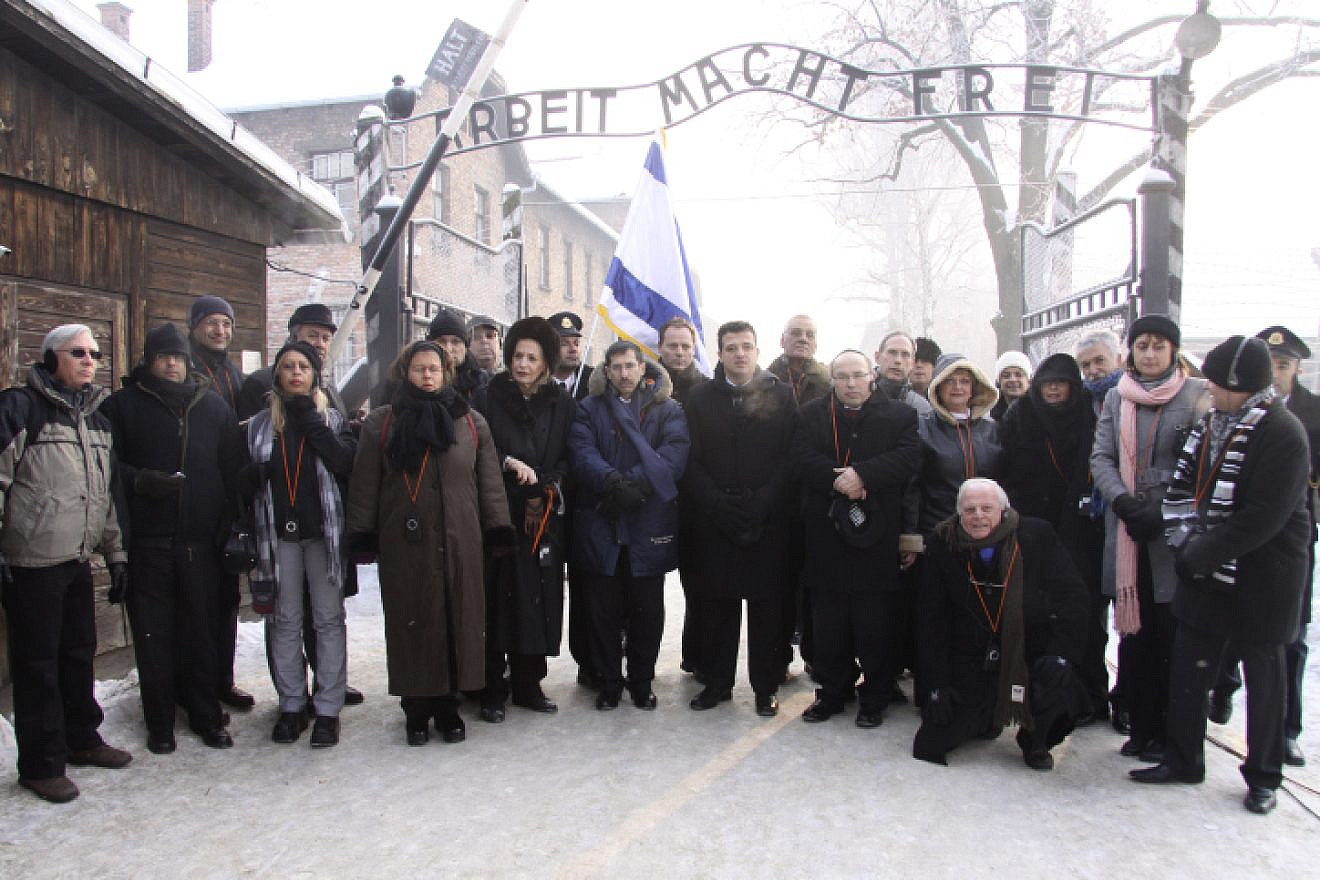 Israel Parliament members pose for a group picture at the entrance to the Auschwitz concentration camp in Poland on International Holocaust Remembrance Day, Jan. 27, 2010. Photo by Isaac Harari/Flash90.