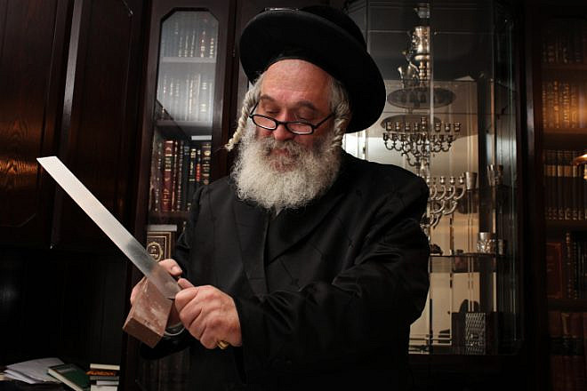 File photo: Rabbi Yitzchak Eliezer Yakav, chief slaughterer from the Chief Rabbinate of Israel, responsible for kosher slaughter of cattle imported to Israel from South America, on June 12, 2011. Photo by Kobi Gideon/Flash90.