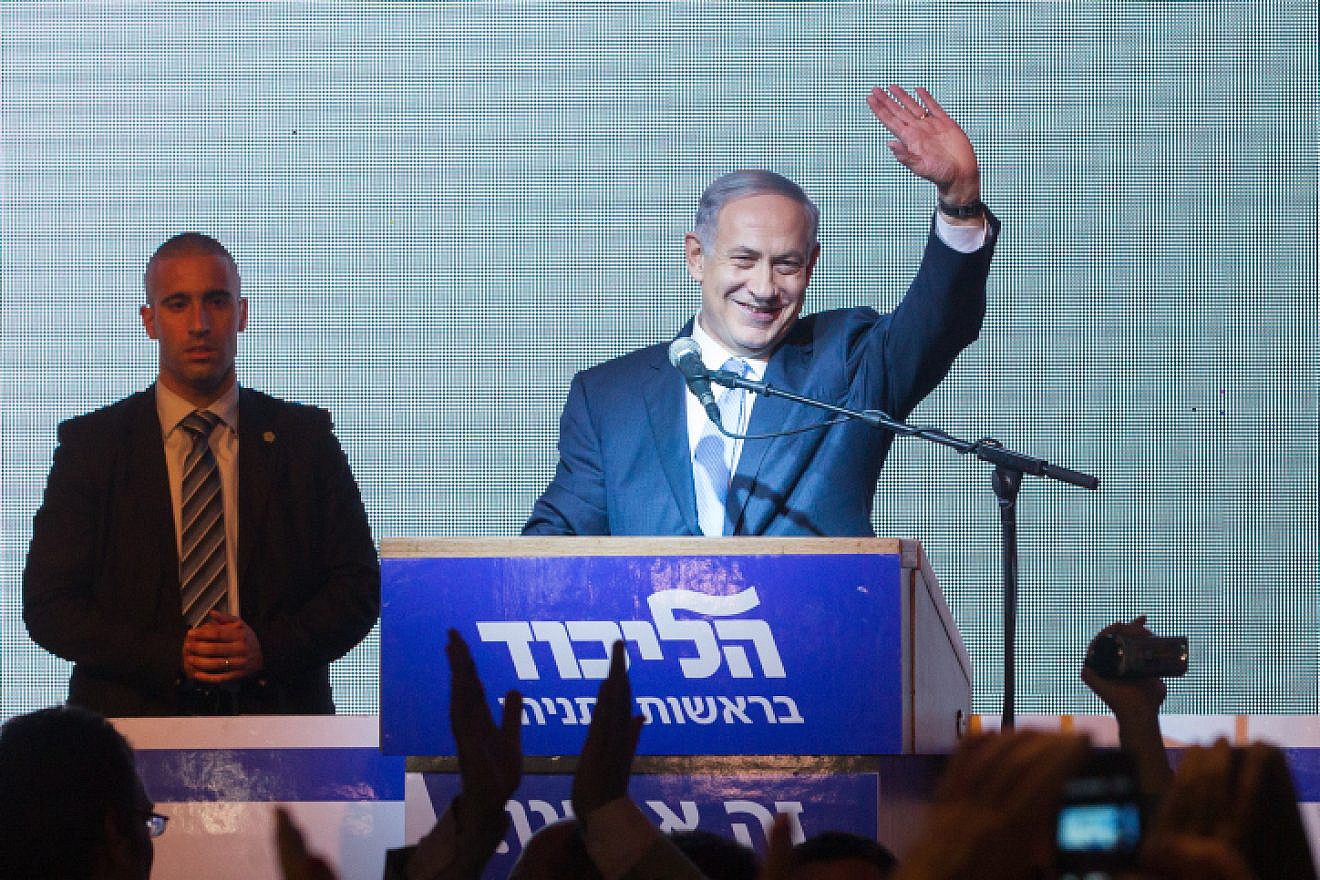 Israeli Prime Minister Benjamin Netanyahu waves to supporters at Likud headquarters in Tel Aviv on March 18, 2015, after general elections with Netanyahu claiming victory. Photo by Miriam Alster/Flash90.