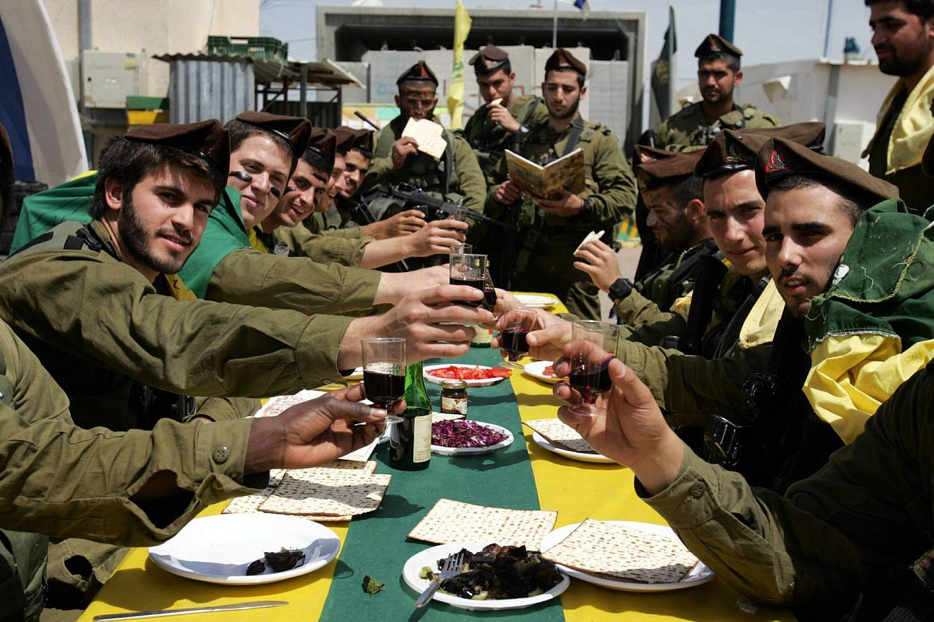Israeli soldiers of the Golani Brigade eat a Passover meal. Credit: Edi Israel/Flash90.