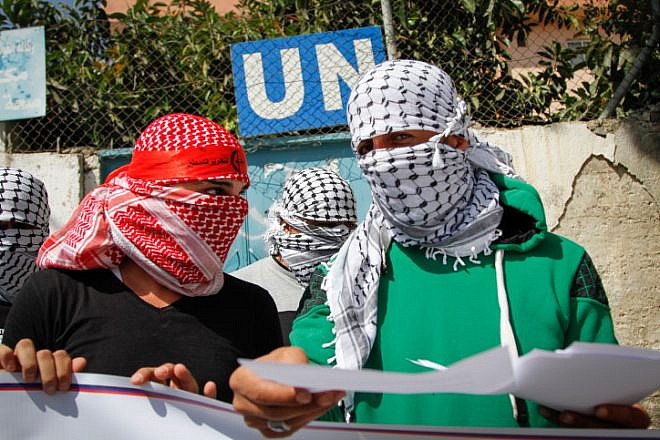 Masked Palestinians demonstrate in the Balata refugee camp in protest against the policy of Scott Anderson, director of UNRWA in the West Bank, on Sept. 17, 2017. Photo by Nasser Ishtayeh/Flash90.