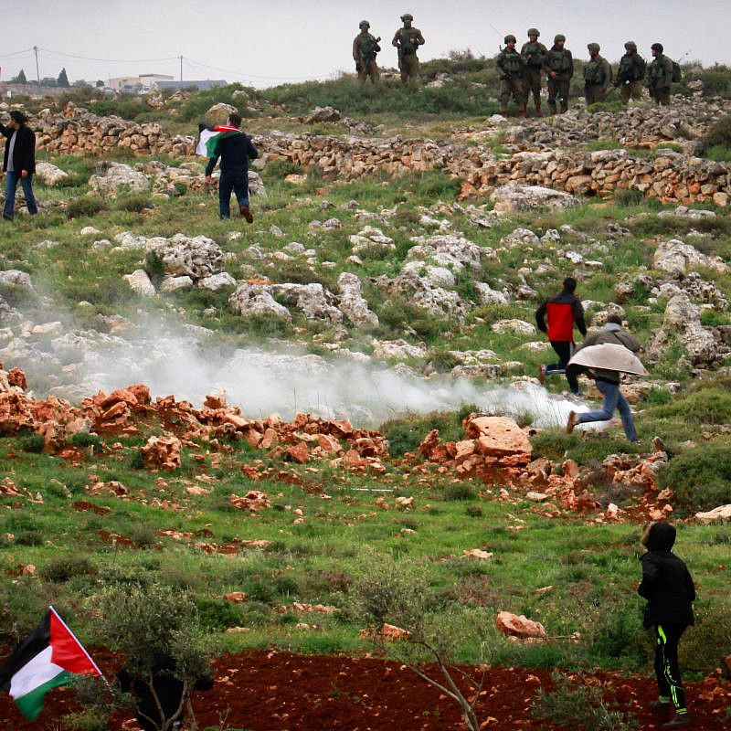 Palestinian protesters clash with Israeli troops during a protest marking “Land Day” in the West Bank city village of Qusra near Nablus on March 30, 2018. Photo by Nasser Ishtayeh/Flash90.