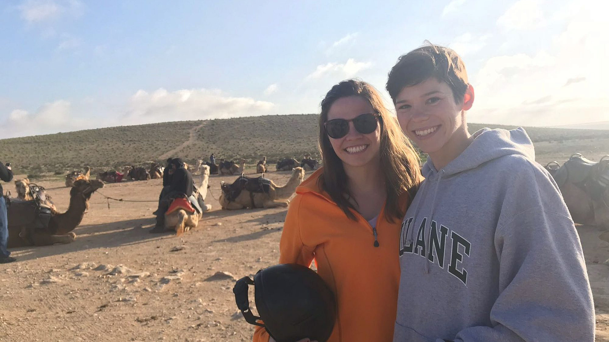 Natalie (right) and Katherine (left) Dubin pose in front of a Birthright staple: camel rides. Credit: Natalie Dubin.