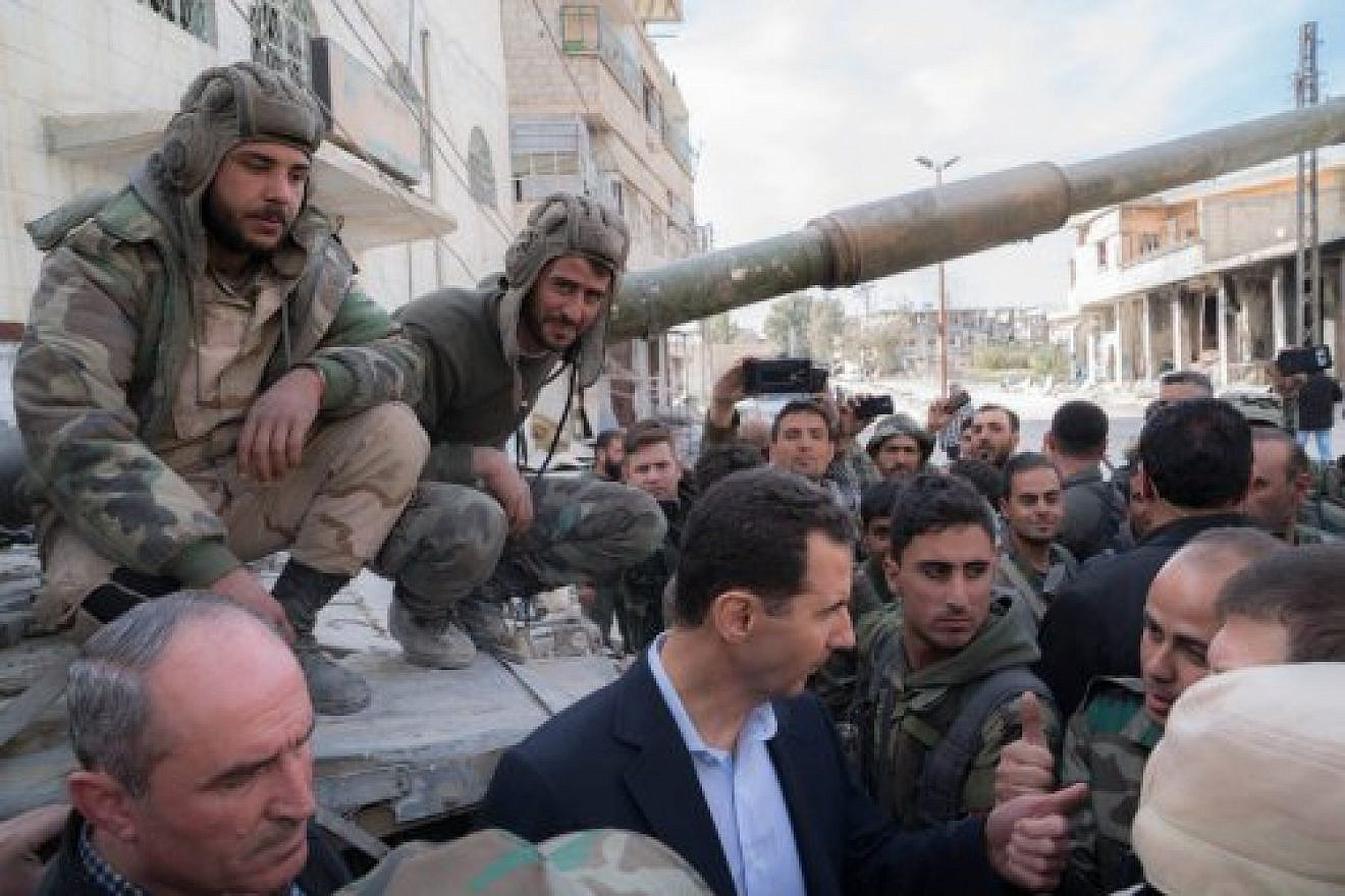 Syrian President Bashar Assad (center front) in Ghouta on March 18, 2018. Credit: Syrian President’s Office-JCPA.