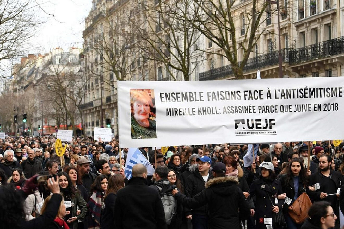 Marchers honor the memory of Holocaust survivor Mireille Knoll, 85, who was murdered in March 2018 in an anti-Semitic attack. Credit: European Jewish Press.
