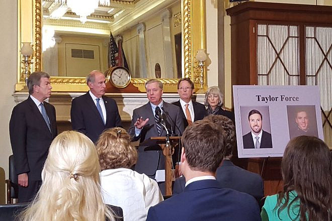 The Taylor Force Act being introduced by Sen. Lindsey Graham (R-S.C.), Sen. Dan Coats (R-Ind.) and Sen. Roy Blunt (R-Mo.) in 2016. Taylor Force’s father, Stuart Force is pictured at the center-right. Source: Twitter.