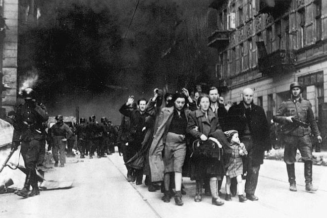 Captured Jews who participated in the Warsaw Ghetto Uprising are rounded up by the Waffen SS on Nowolipie Street between April 19 and May 16, 1943. Credit: Wikimedia Commons.