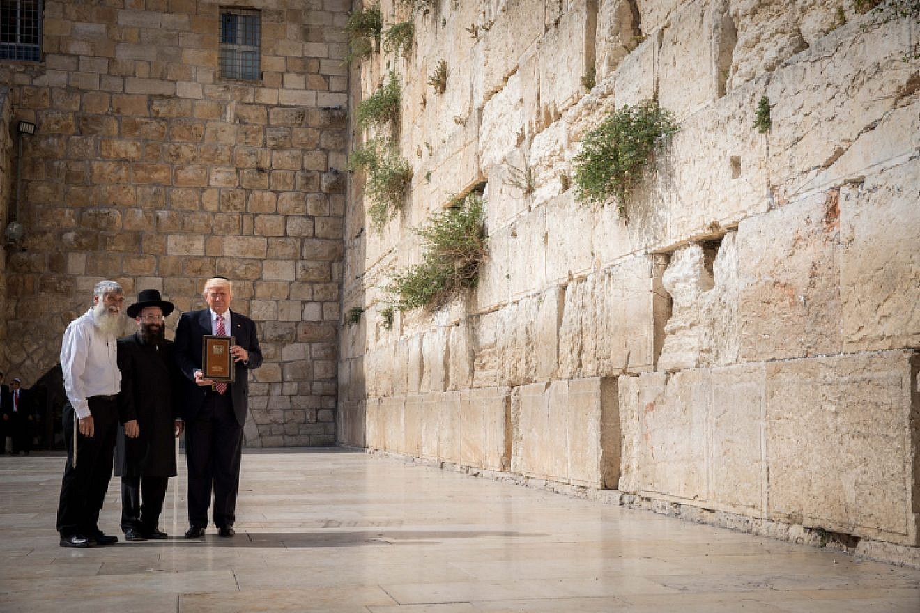 U.S. President Donald Trump at the Western Wall, Judaism's holiest prayer site, in the Old City of Jerusalem on May 22, 2017. To his left is the rabbi of the wall, Chabad Rabbi Shmuel Rabinovitch. Photo by Nati Shohat/Flash90.