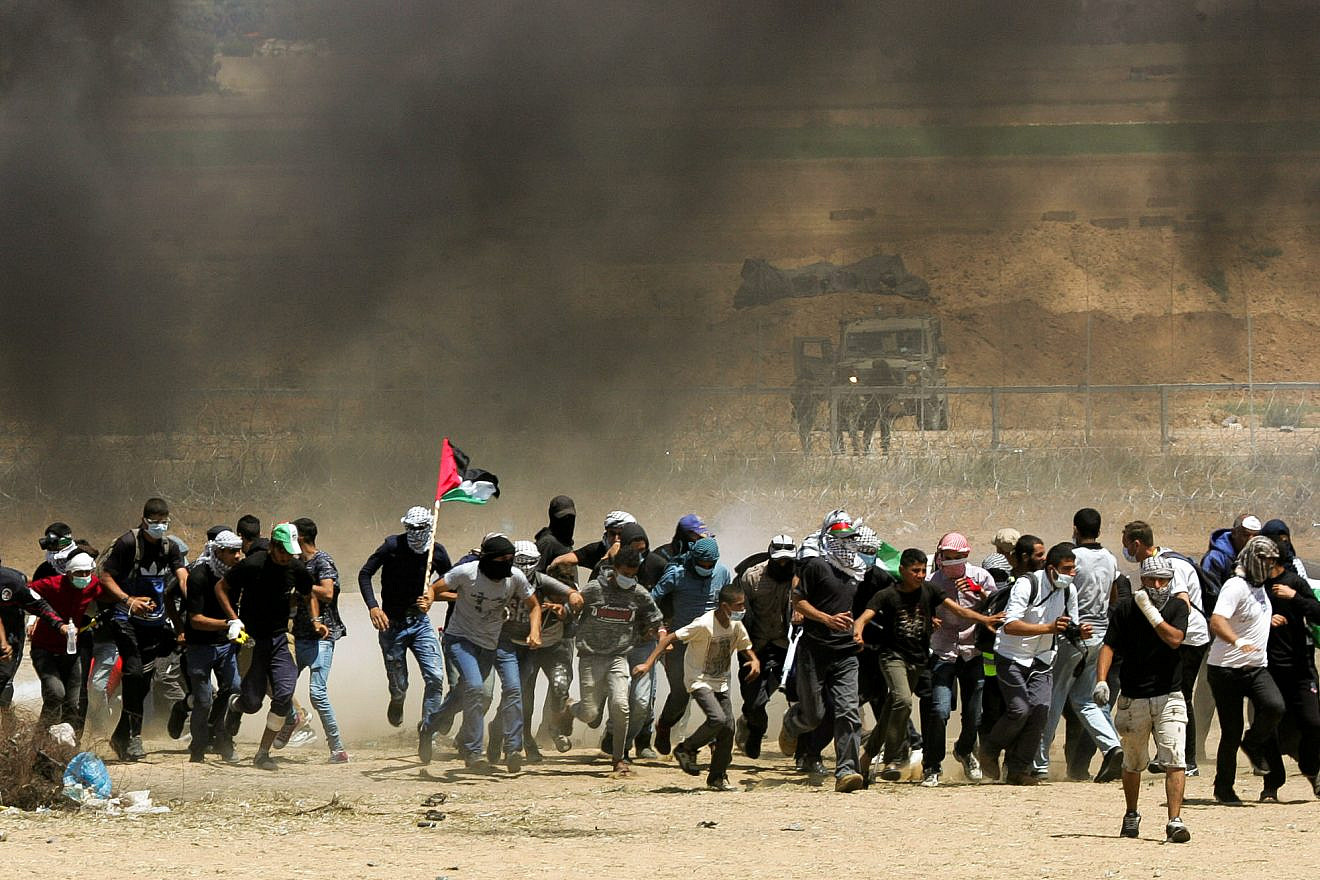Palestinian protesters during clashes with Israeli forces along the border with Gaza on May 11, 2018. Credit: Abed Rahim Khatib/Flash90.
