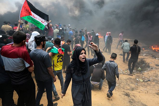 Palestinian protesters clash with Israeli forces near the Gaza-Israel border on May 14, 2018. Credit: Abed Rahim Khatib/Flash90.